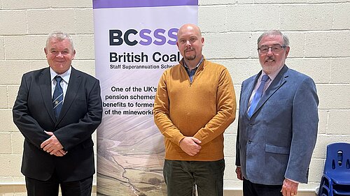 Cameron Thomas stands with members of the British Coal Staff Superannuation Scheme